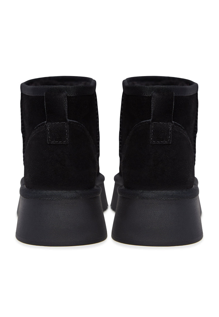 Stay stylish and cozy this winter with a pair of black suede platform boots - the perfect winter footwear choice.