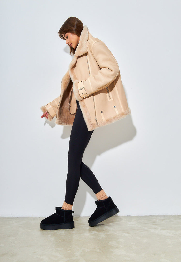Stay warm and stylish this winter with these black suede platform boots, the perfect addition to your winter footwear collection.