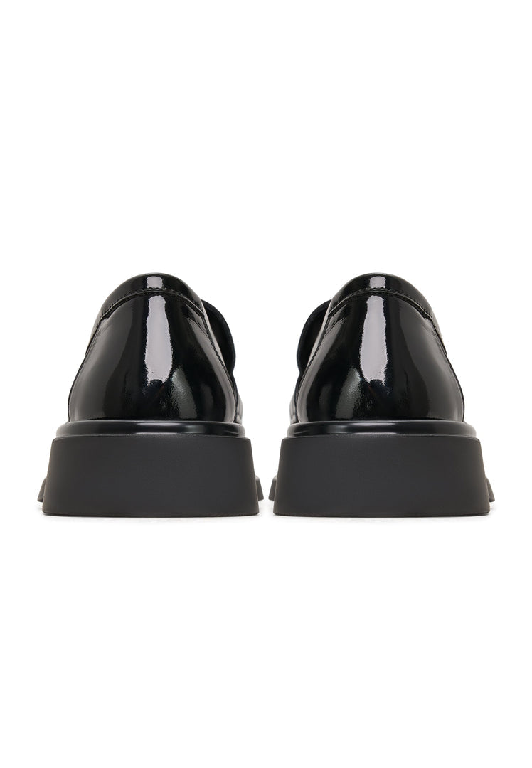 A pair of stylish black leather loafers, perfect for the rockstar-inspired men's fashion footwear look.