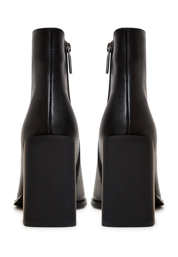 A pair of stylish women's leather ankle boots with a block heel in classic black, the perfect fashionable choice for any outfit.