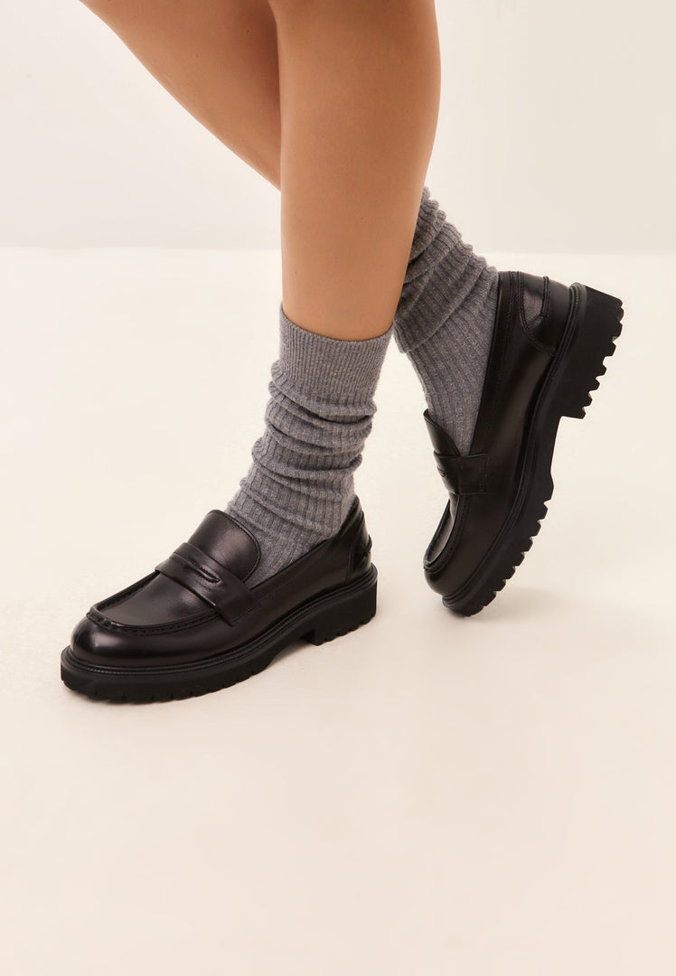 A stylish pair of black leather Dennise loafers, perfect for men who appreciate quality leather shoes.