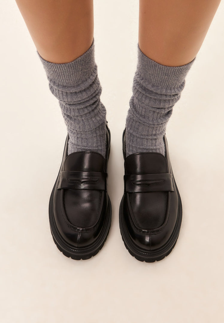 A stylish pair of black leather loafers known as Dennise loafers - perfect leather shoes for men.