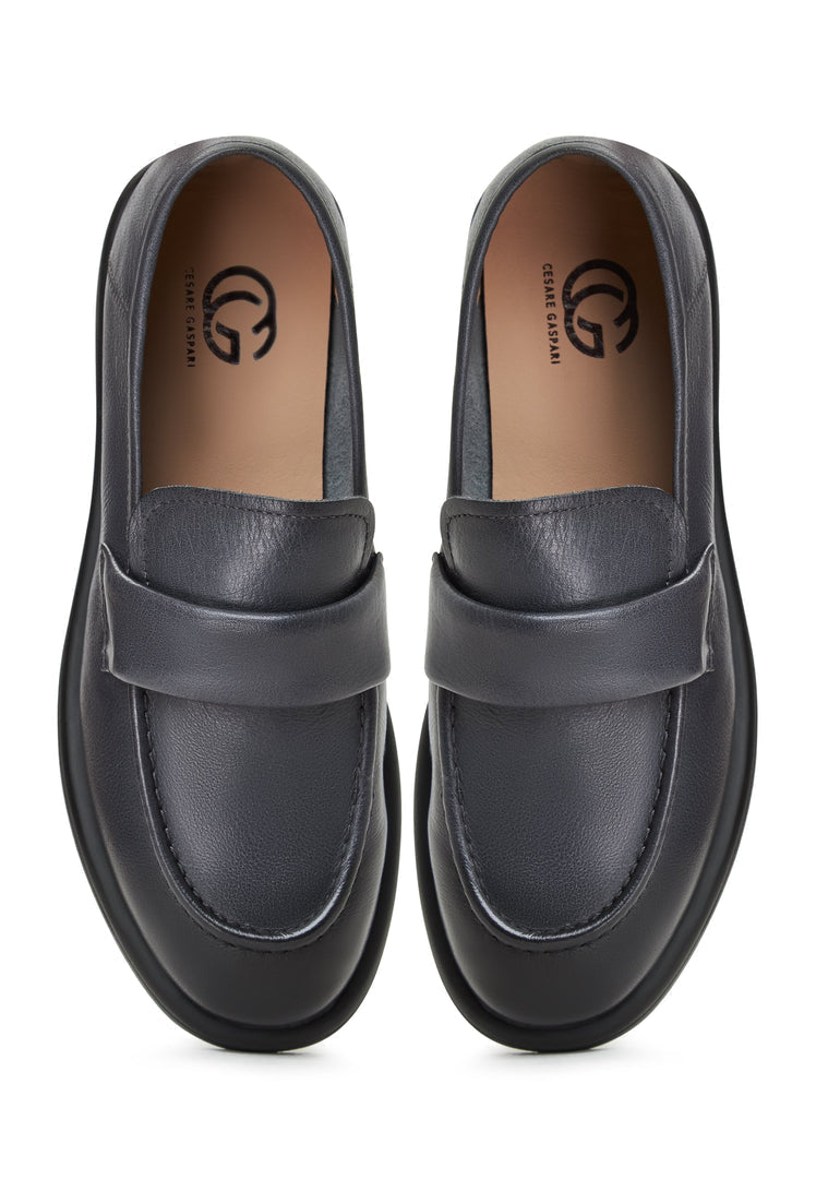 A stylish pair of grey block heeled loafers from the Stephanie brand, perfect for women looking for chic and comfortable slip-on shoes.