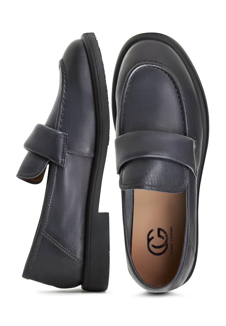 A stylish pair of Stephanie grey block heeled loafers, perfect for women looking for trendy slip-on shoes from the Stephanie brand.