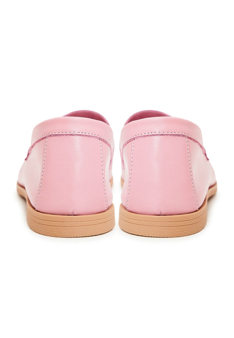 A stylish pair of women's pink leather loafers, high quality designer shoes.