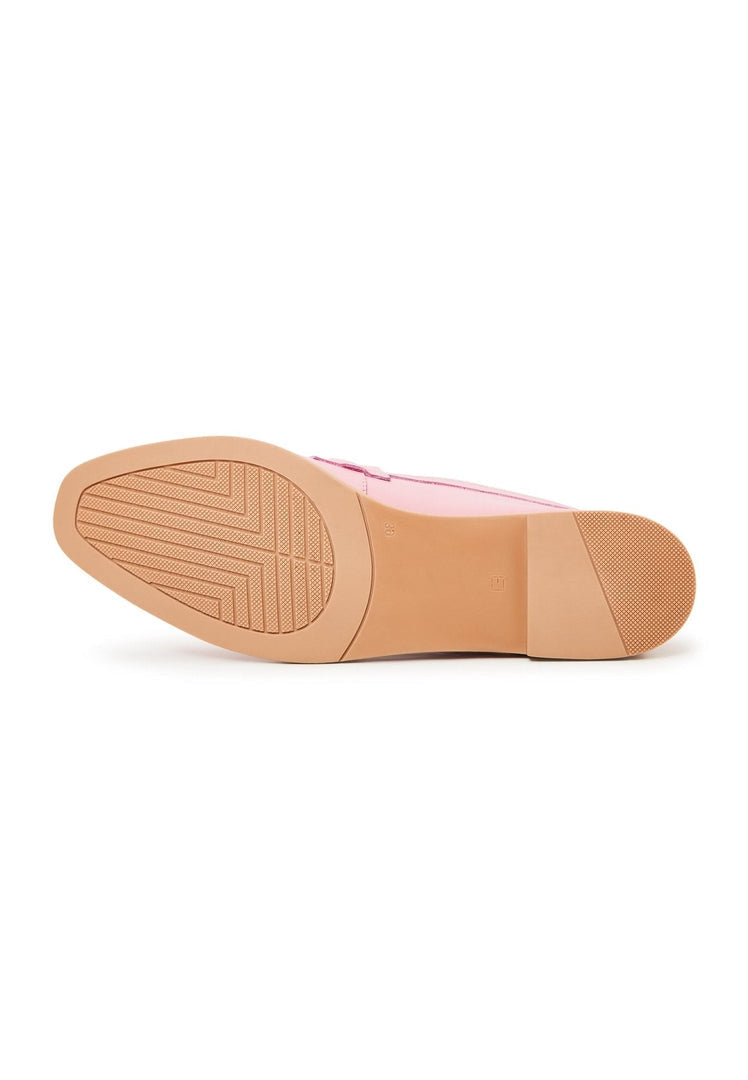 A pair of high-quality pink leather loafers, designer shoes for women.