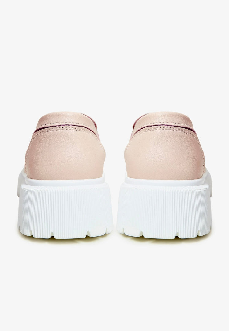 A pair of stylish and comfortable women's pink casual loafers, perfect for any outfit and budget.