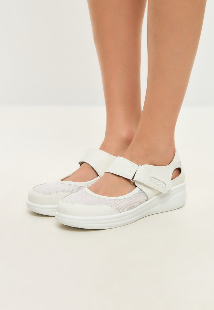 A pair of stylish white leather sneakers, perfect for summer outings and a versatile choice for casual or fashion-forward footwear.
