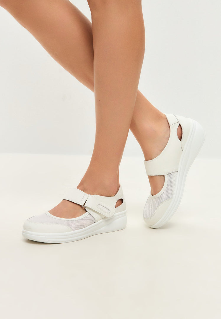 A stylish pair of white leather summer sneakers, perfect for a casual yet fashionable look.