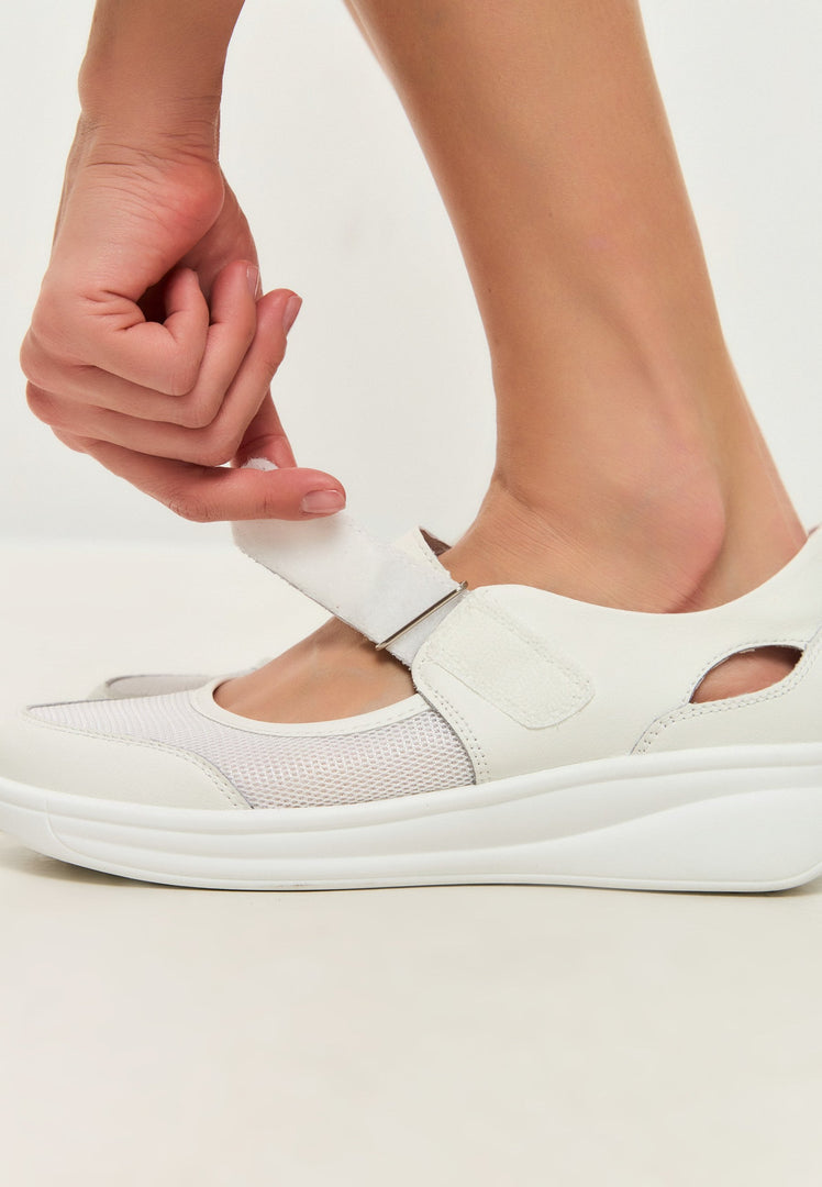 A pair of stylish white leather sneakers, perfect for summer and great for both fashion and casual footwear looks.