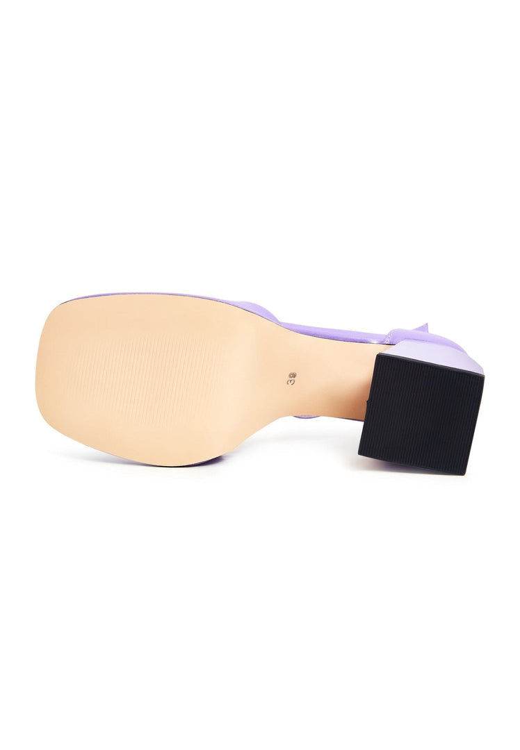 A pair of stylish classic open toe high heel sandals in a beautiful lilac color, perfect to buy online.