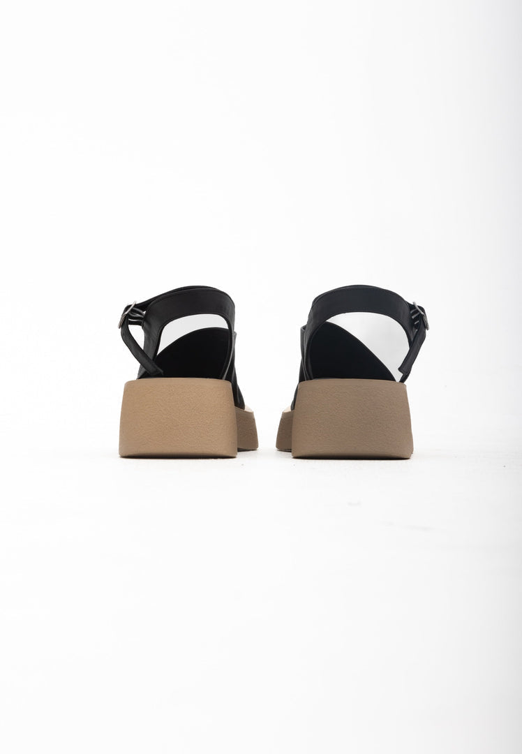 A stylish pair of black women's platform sandals, perfect for casual wear, offering both comfort and style.