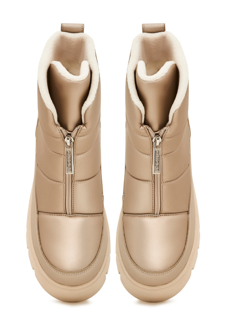A pair of stylish beige winter boots, perfect for snowy weather and adding an elegant touch to your winter outfits.