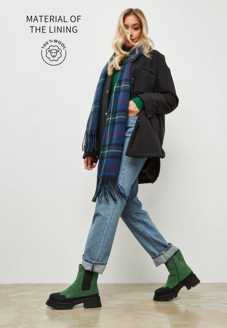 A trendy pair of green platform ankle boots for women, perfect for a stylish urban look.