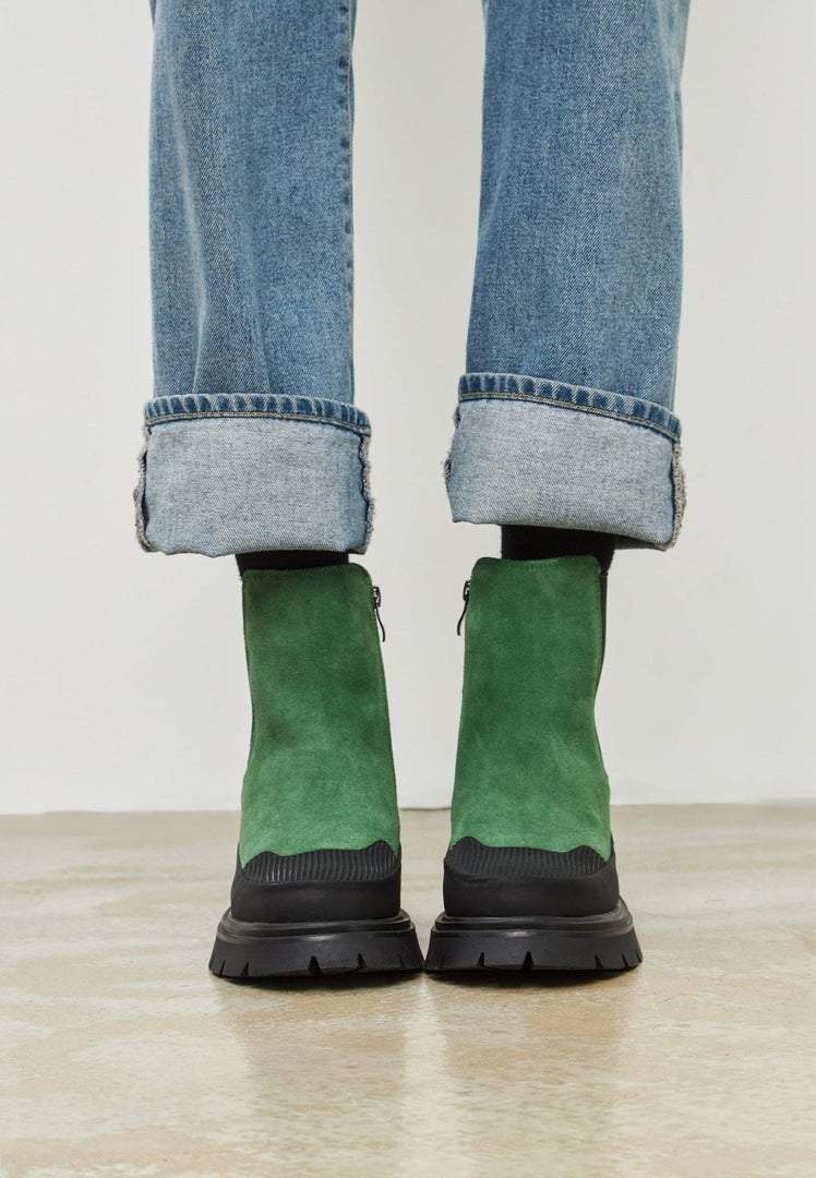 A trendy pair of green urban platform ankle boots for women - stylish, fashionable and perfect for urban fashionistas.