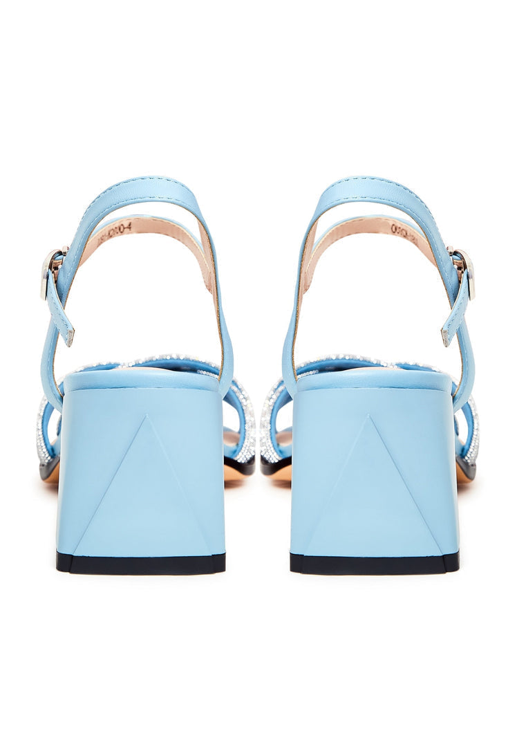A stylish pair of blue leather sandals with block heels, featuring open toes, known as the Andrea sandals.