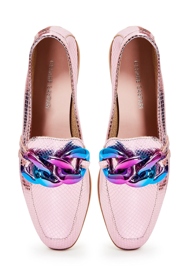 A pair of classic style leather loafers in metallic pink, women's fashion shoes with a flat sole design.
