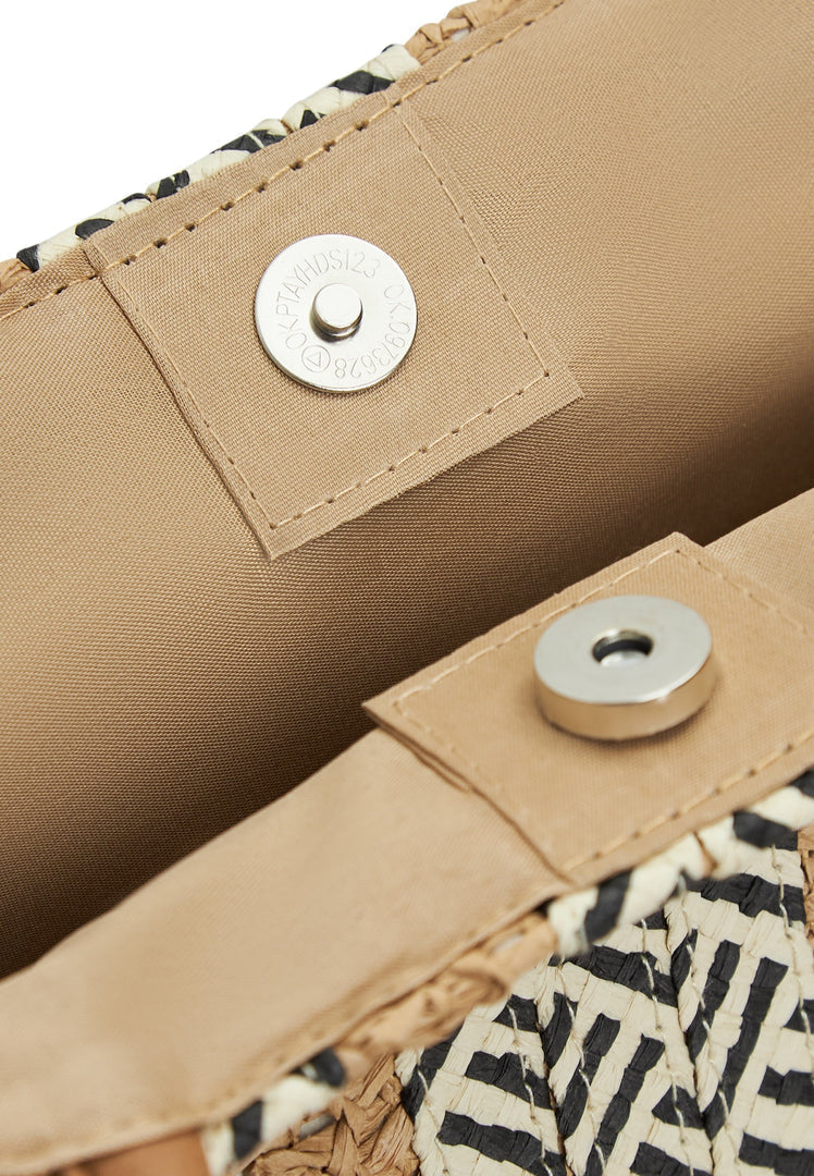 A stylish and spacious beach tote bag perfect for summer days by the water.