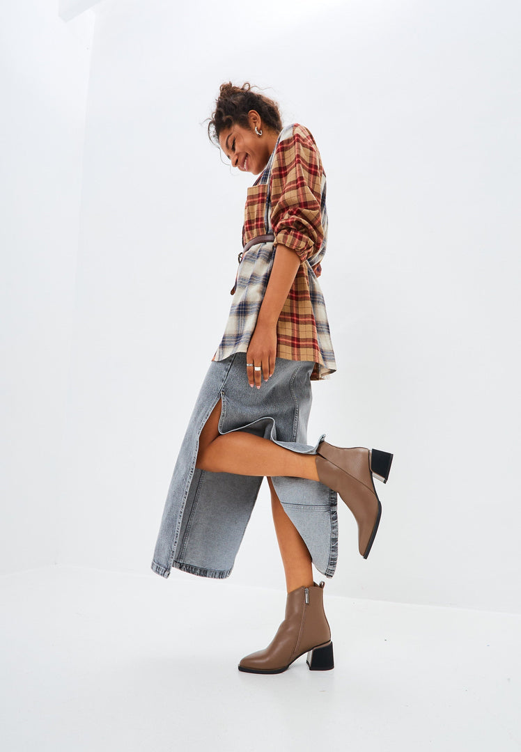 A pair of stylish brown leather women's ankle boots, perfect for a casual yet fashionable look.