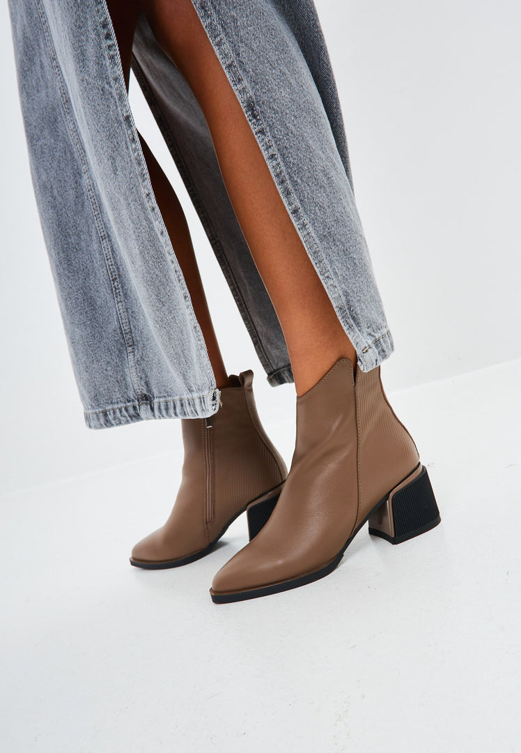 A stylish pair of women's brown leather ankle boots, perfect for any casual occasion.