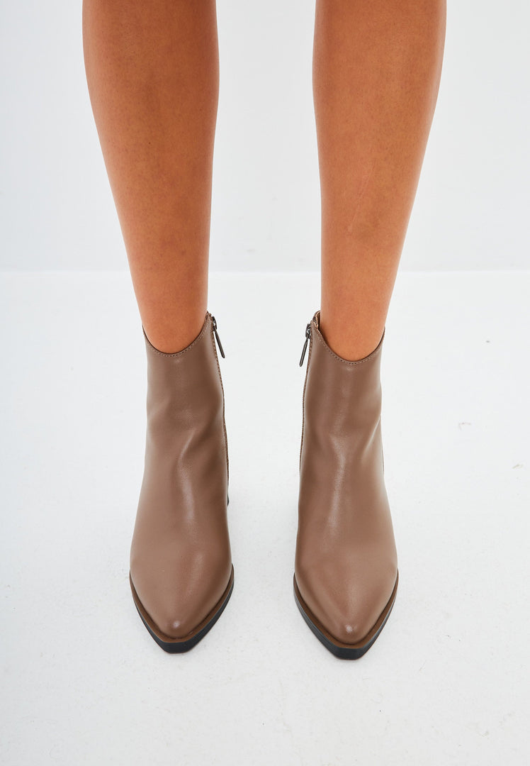 A pair of stylish brown leather women's ankle boots, perfect for a casual and chic look.