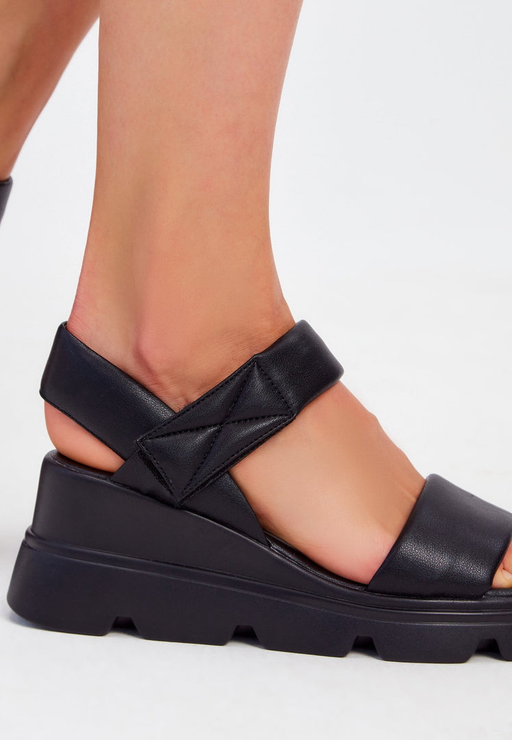 A stylish pair of leather platform sandals perfect for urban chic looks.