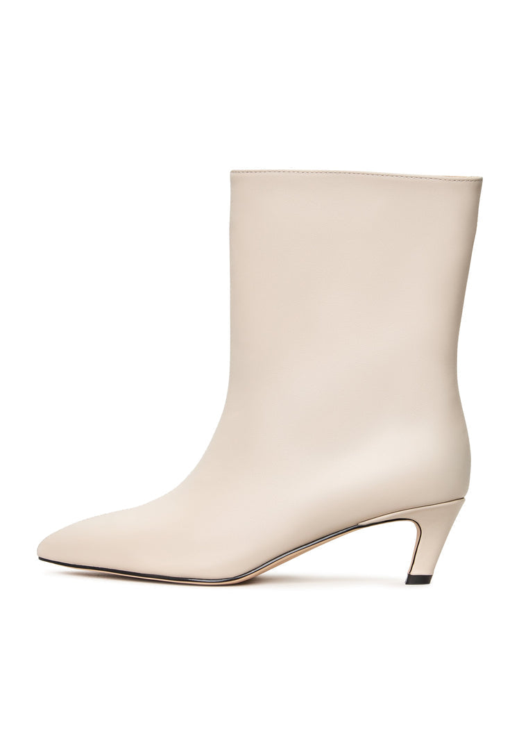 A pair of trendy white kitten heel ankle boots, perfect for any fashion-forward woman's wardrobe.