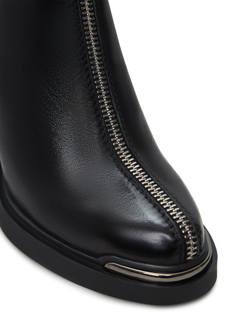 A pair of stylish black zipper heel boots, a modern take on the classic Thrud boots, perfect fashion footwear.