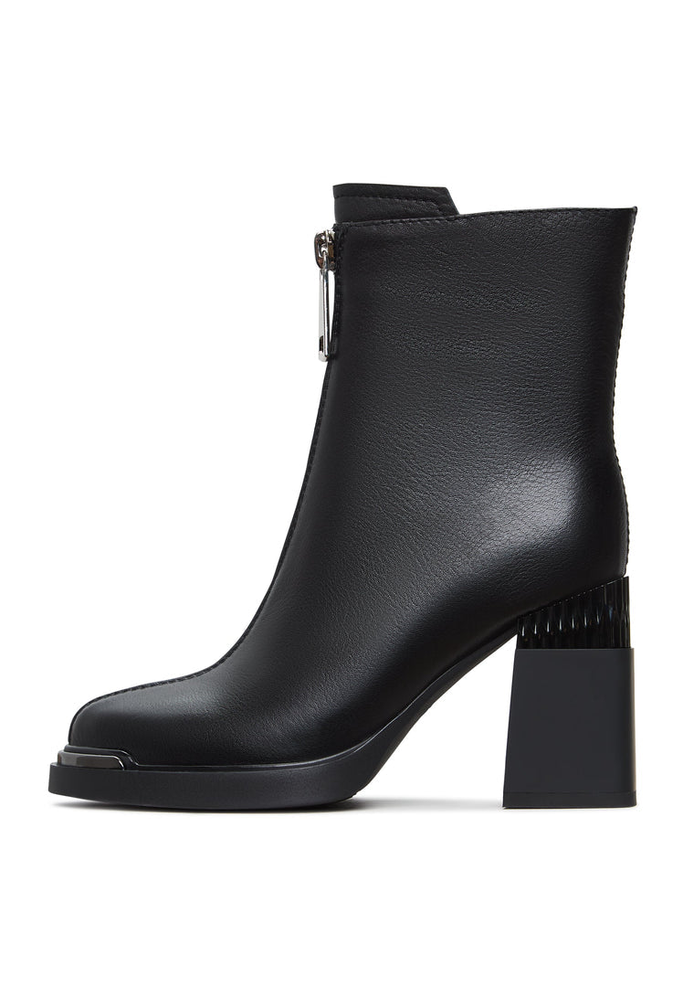 A stylish pair of black zipper heel boots - a modern take on fashion footwear, also known as Thrud boots.