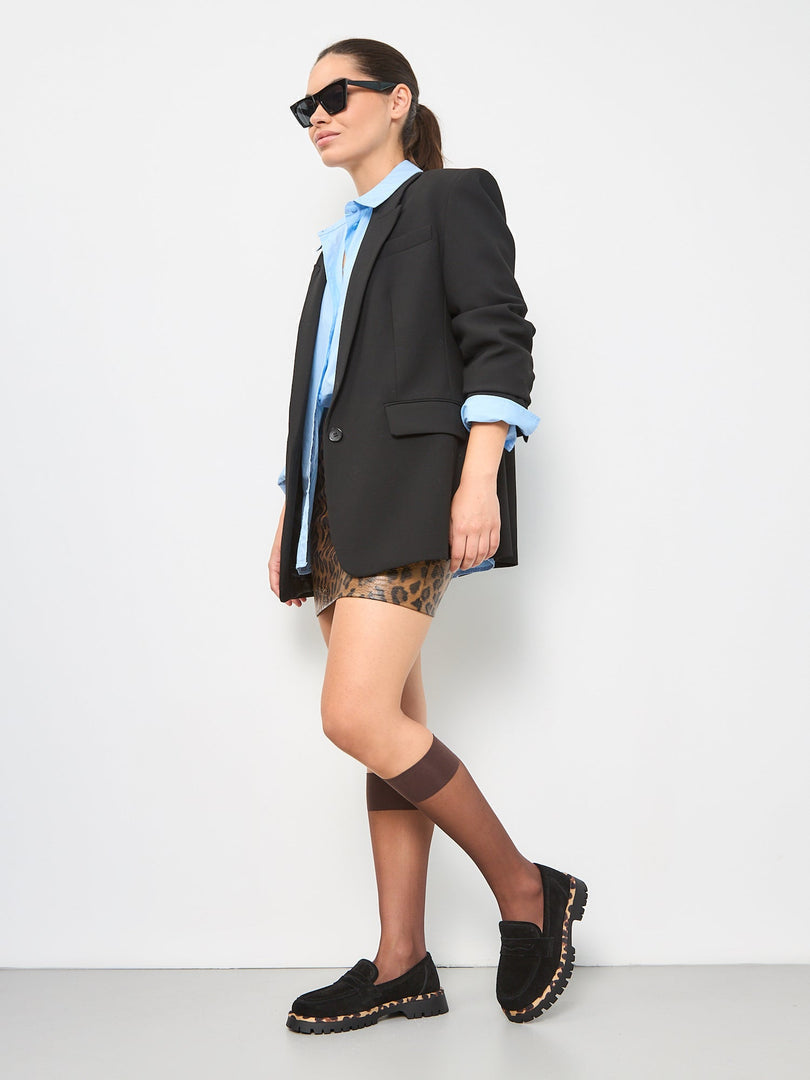A pair of chic black Lily loafers with a stylish chunky sole, creating fashionable and trendy footwear.