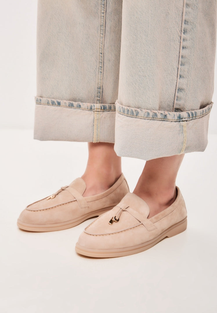A pair of stylish beige Aemilia winter loafers for women - perfect cold weather footwear.