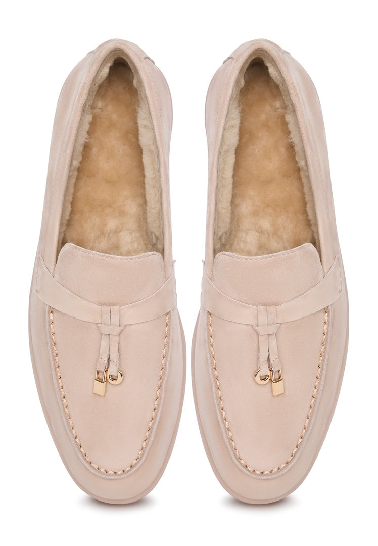 A pair of stylish beige Aemilia loafers, perfect women's winter shoes for cold weather, featuring a cozy and fashionable design for the season.