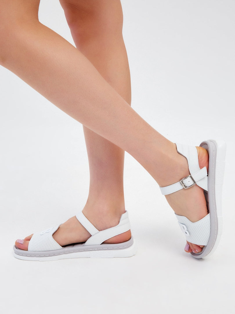 A pair of trendy white platform sandals perfect for the urban fashionista.