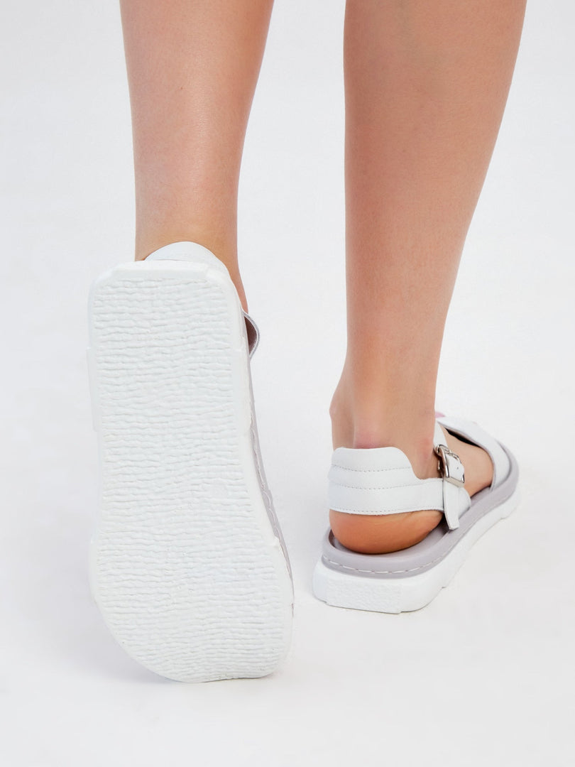 A stylish pair of women's trendy platform sandals in urban white, perfect for a fashionable look.