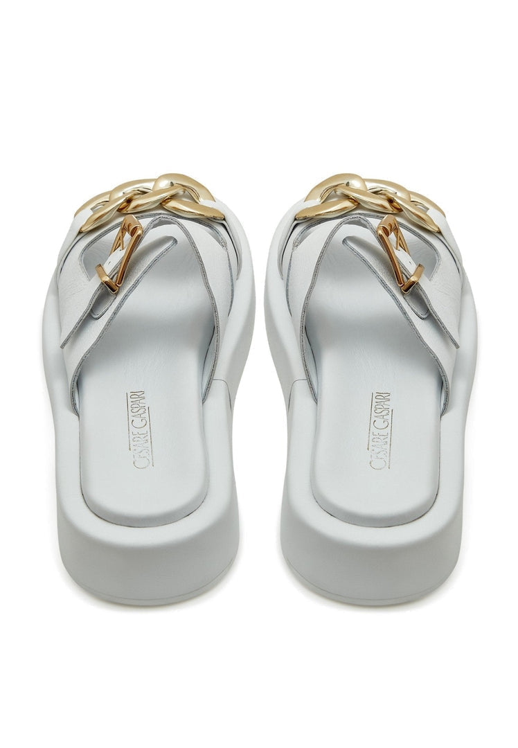 A pair of stylish white leather chain sandals for women, perfect for summer.