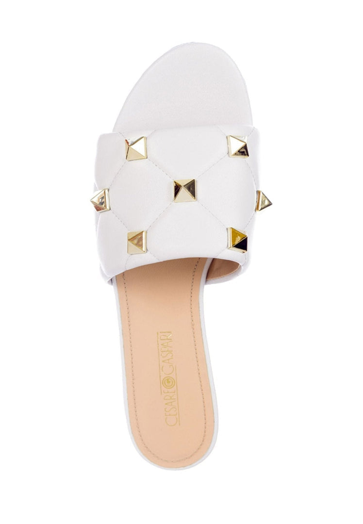 Stylish white Rockstud and Mila sandals, perfect for any summer outfit.