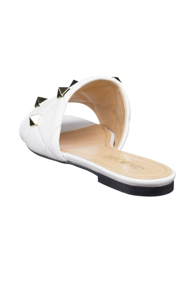 Stylish white Rockstud sandals and Mila sandals with edgy rockstud detailing, perfect for a chic summer look.