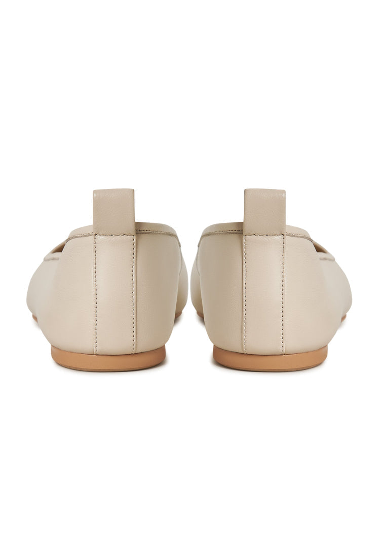 A stylish pair of ivory leather ballerinas, perfect for women looking for elegant and comfortable leather flats, ivory ballet flats, or leather slip-on shoes to complete their outfit with a touch of sophistication.