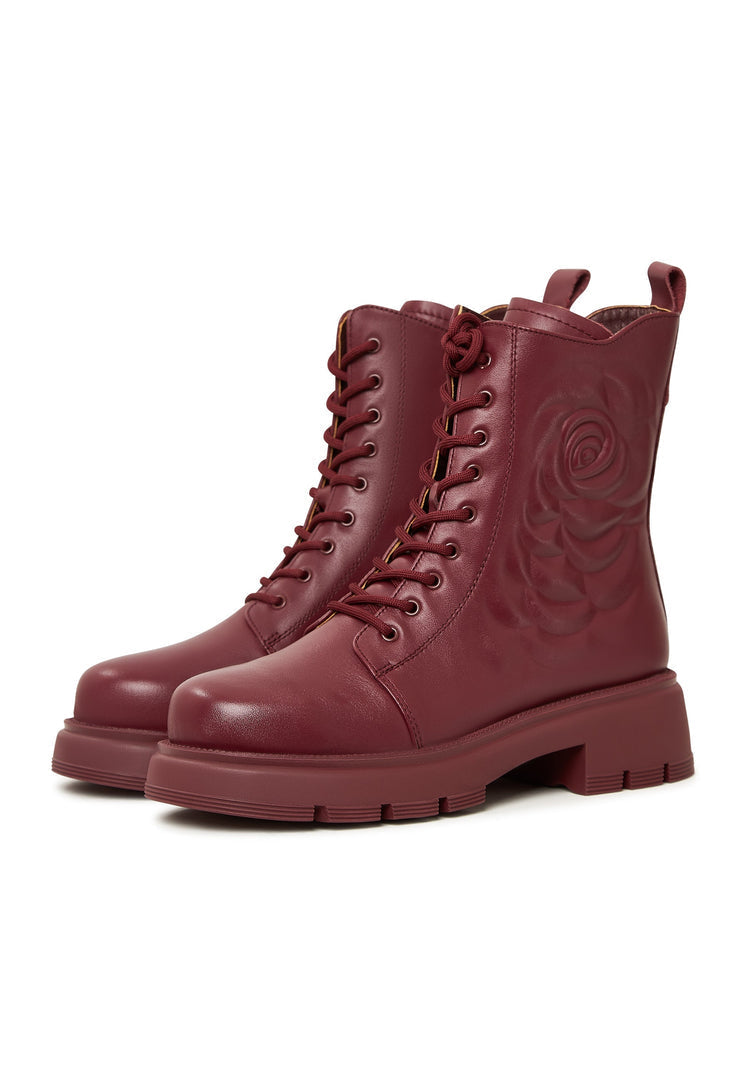 A stylish pair of women's leather platform ankle boots in bordeaux color with high heels, perfect for elevating any outfit.