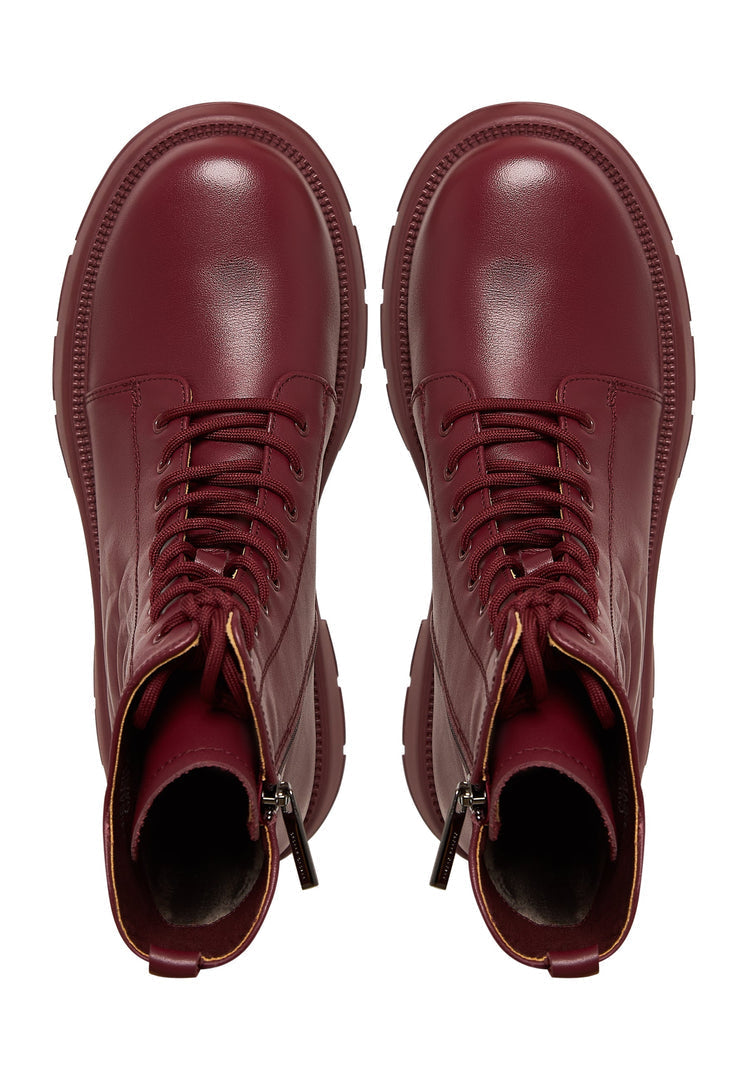 A stylish pair of bordeaux leather platform ankle boots for women, featuring high heels and are a fashionable choice for any outfit.