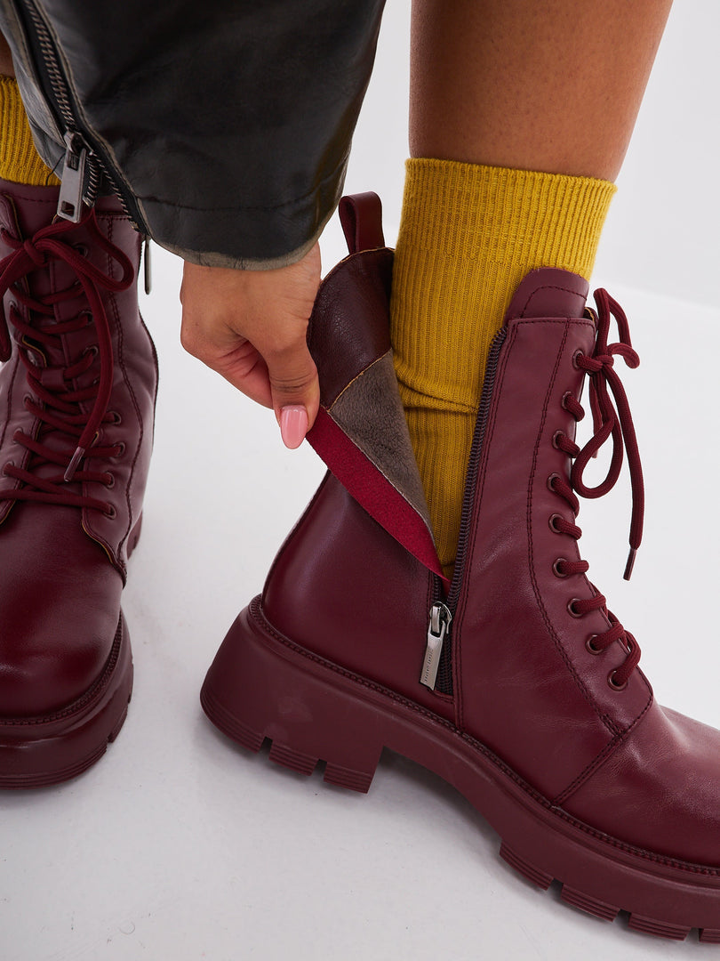 A stylish pair of leather platform ankle boots in deep Bordeaux color, perfect for women who love high heel ankle boots and fashionable ankle footwear.