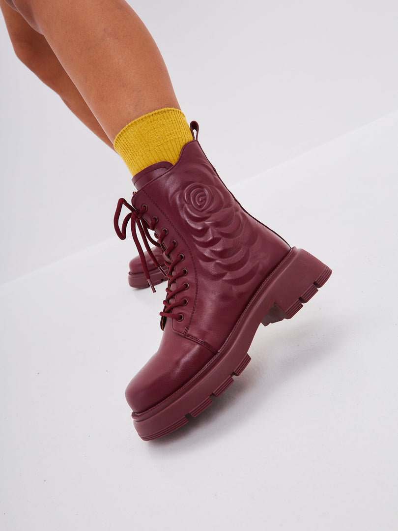 A pair of fashionable high heel leather platform ankle boots in Bordeaux color for women, perfect for any stylish outfit.