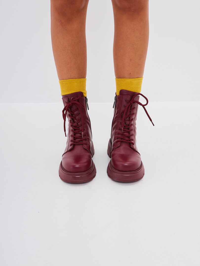 A stylish pair of bordeaux leather platform ankle boots, perfect for adding a touch of sophistication to any outfit. These high heel ankle boots are a must-have for any fashion-forward woman's collection of fashionable ankle footwear.