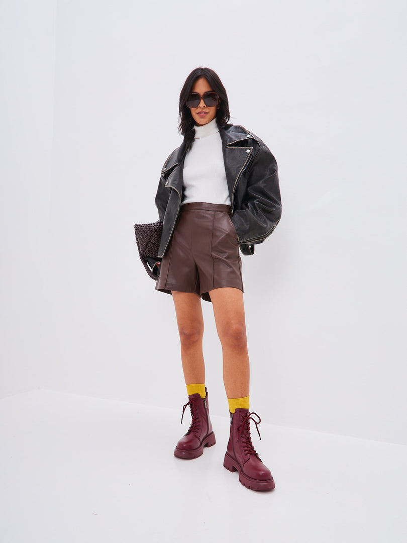 A chic pair of women's high heel leather platform ankle boots in trendy bordeaux color, perfect for fashion-forward looks.