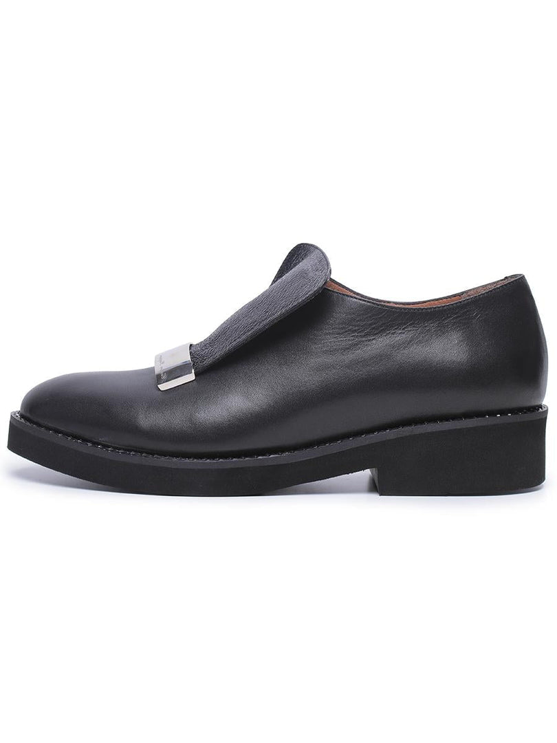 A pair of stylish men's leather slip-on loafers with metal accent detail, a fashionable choice for any outfit.