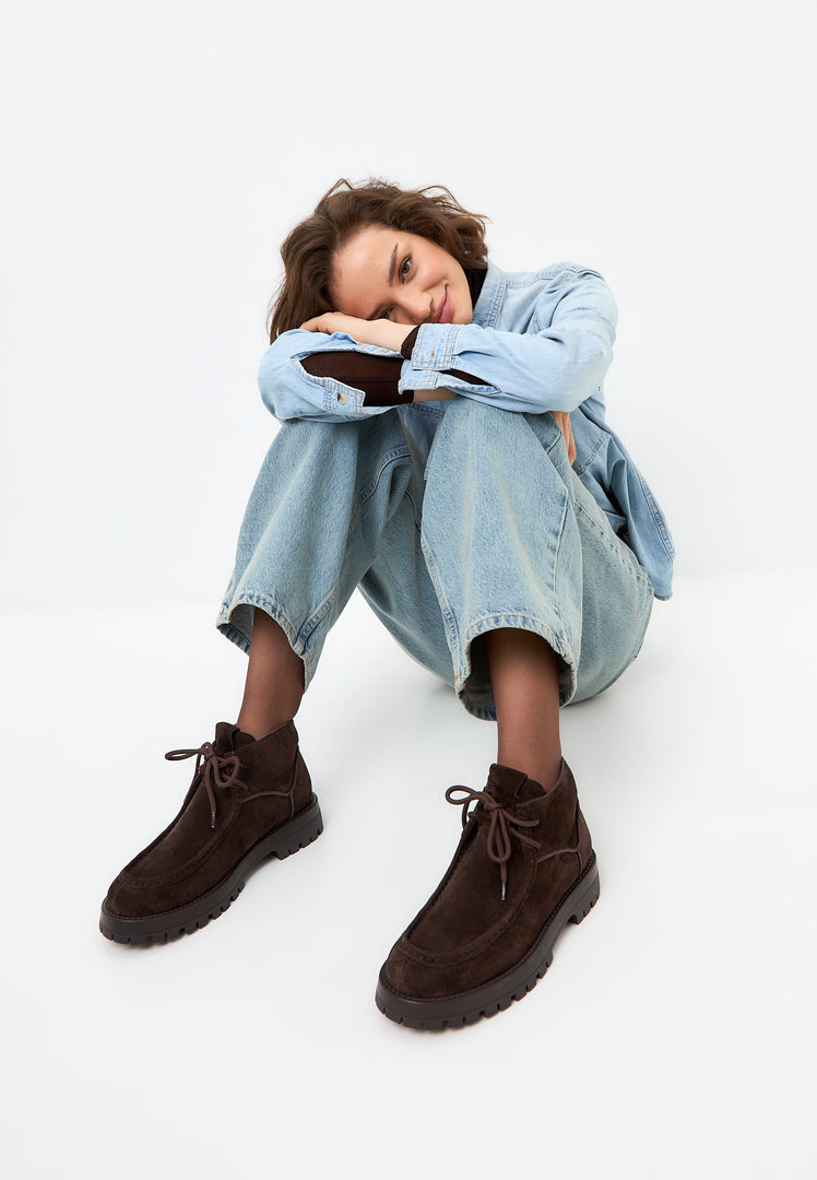 A stylish pair of brown suede lace-up Mavi ankle boots for women.