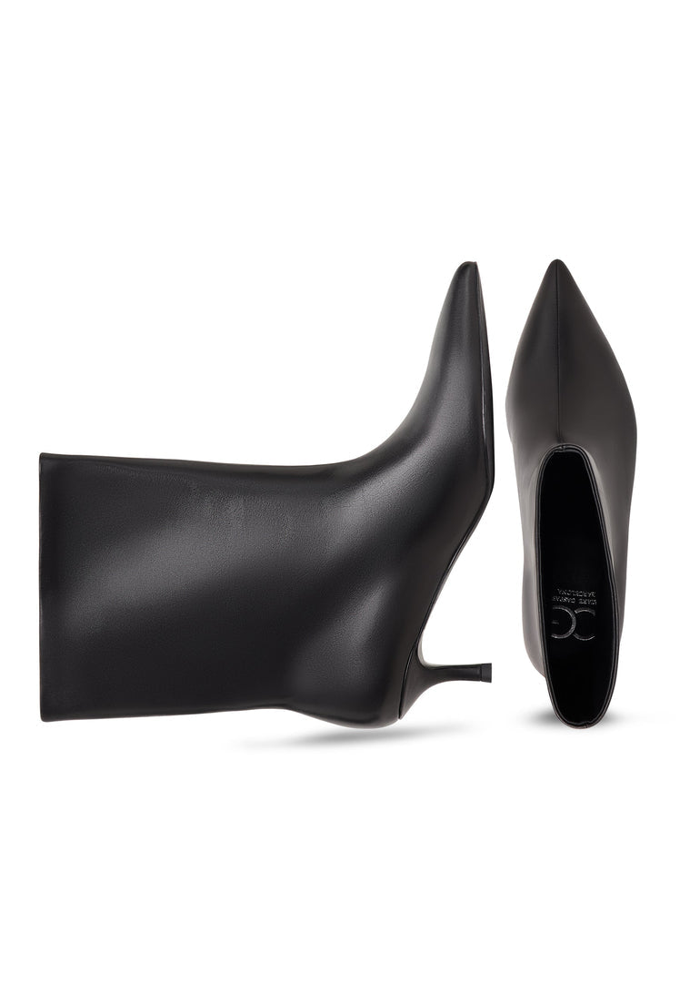 A stylish pair of black ankle boots with kitten heels, known as Regina boots, perfect for women's fashion.