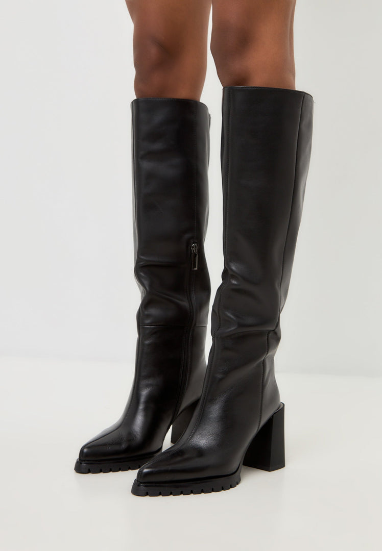 A stylish pair of women's knee-high boots with a fashionable block heel, featuring a bold black design.