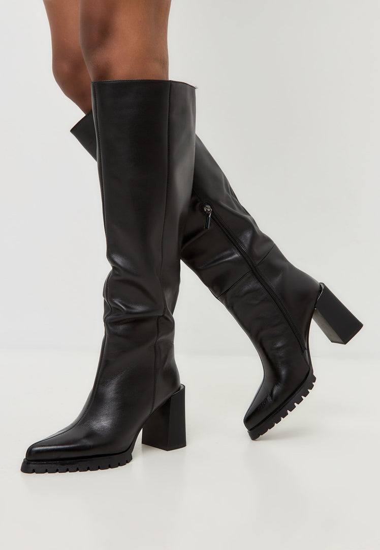 A pair of fashionable women's knee-high boots in bold black color with a trendy block heel style.