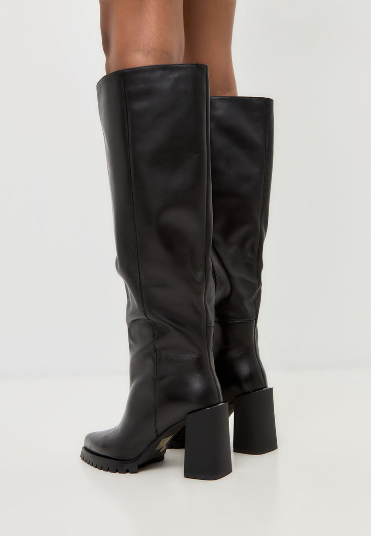 A pair of fashionable women's knee-high boots in bold black color, featuring a chic block heel design.